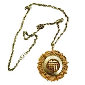 Large vintage starburst gold/silver toned pendant